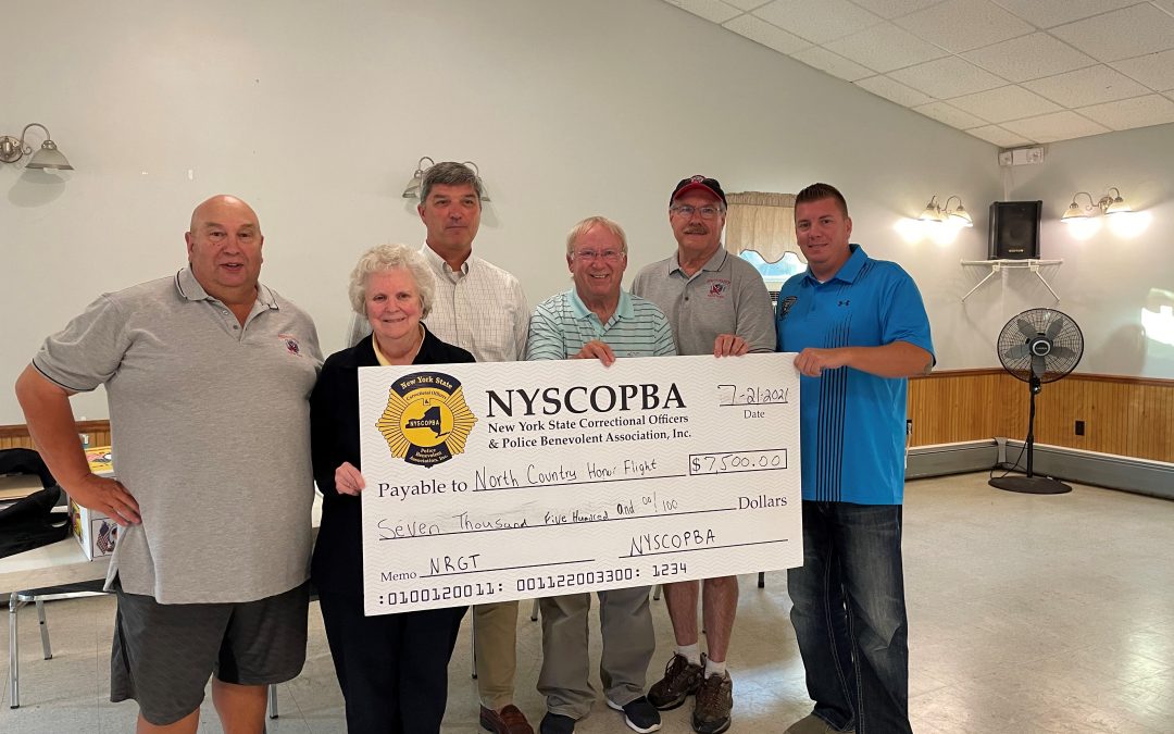 Northern Region Golf Tournament presents check to North Country Honor Flight